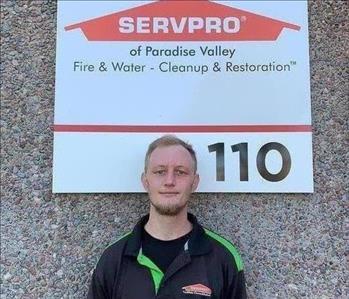 Male employee Marc in front of SERVPRO sign